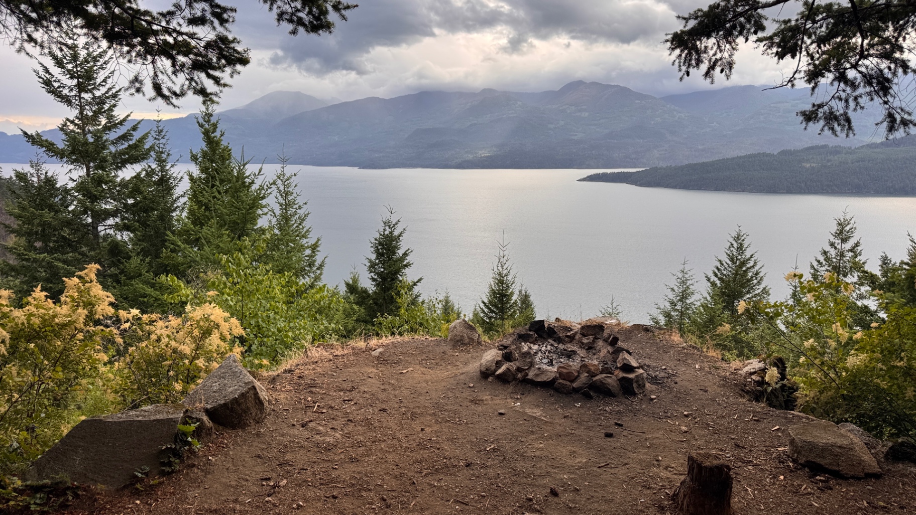 Natural fire ring at the edge of the pullout overlooking Harrison Lake