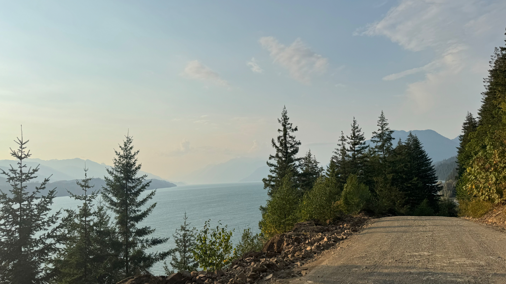 Harrison Lake stretching into hazy Coast Mountains from a high FSR pullout