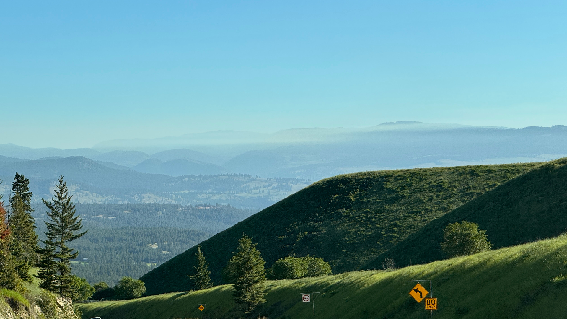 Rolling hills and hazy ridgelines east of Manning