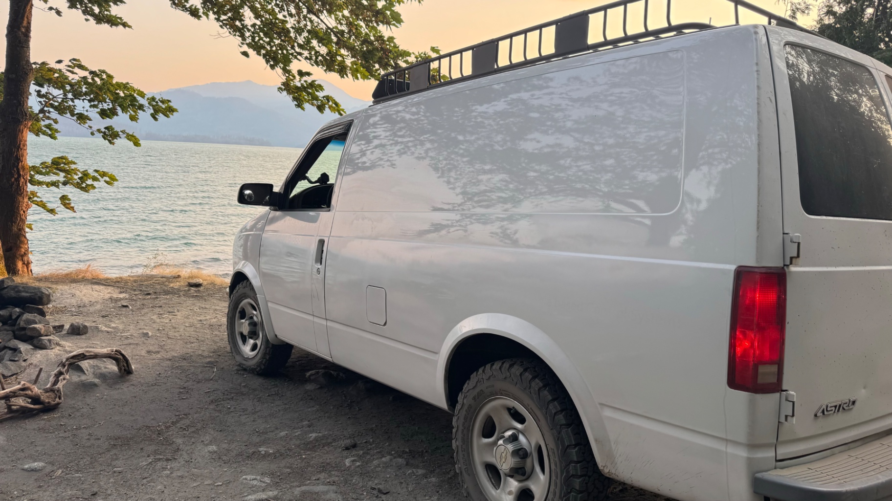 Astro parked lakeside on a smoky Harrison Lake evening